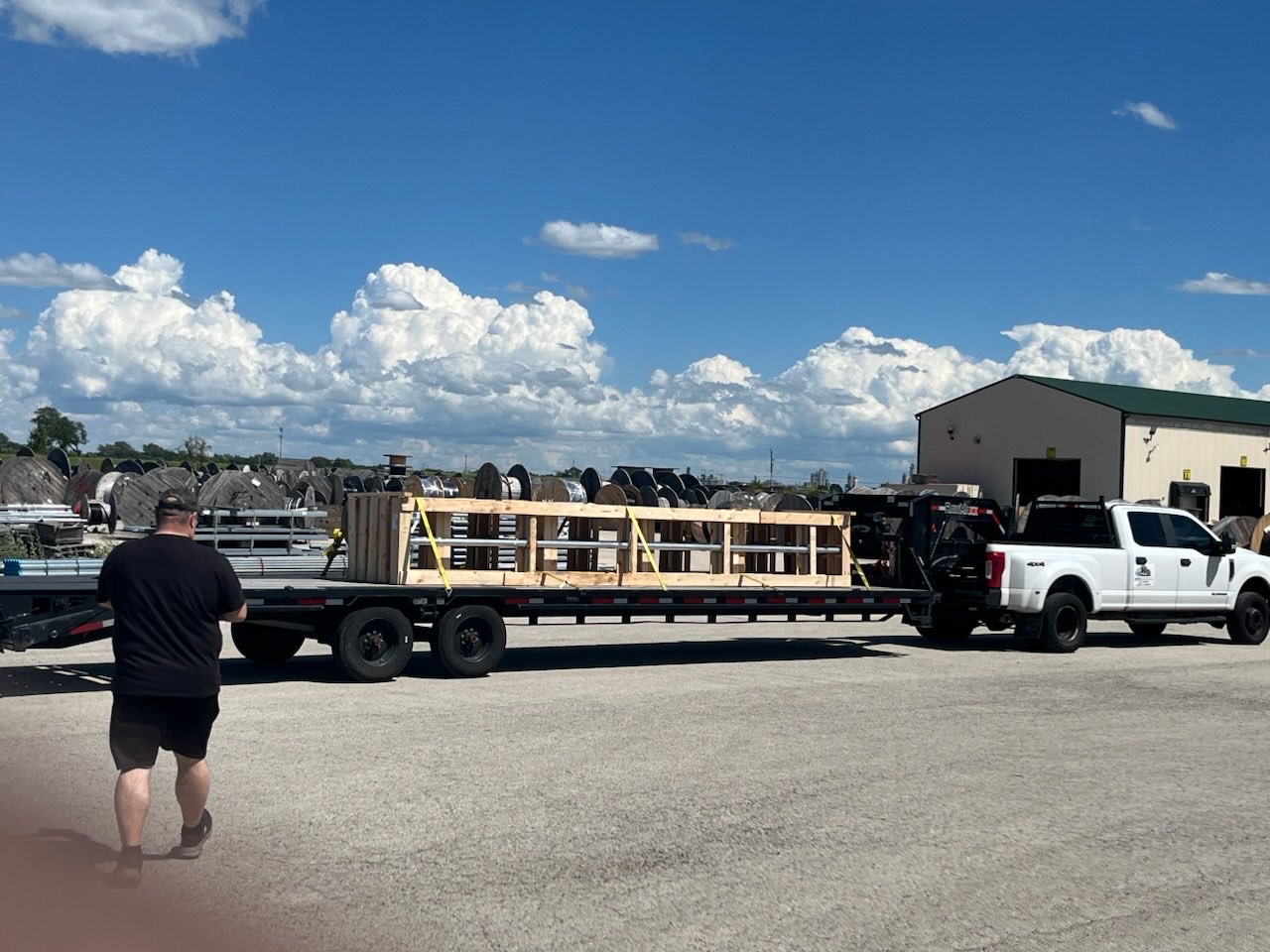Crated freight strapped to a LeadFoot Express gooseneck trailer