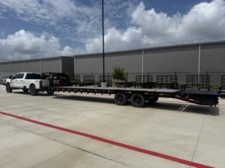 Empty gooseneck flatbed ready for dispatch